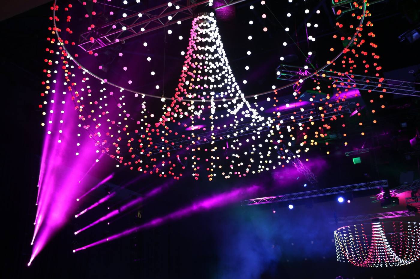 Suspended LED pixel ball chandelier with magenta beams